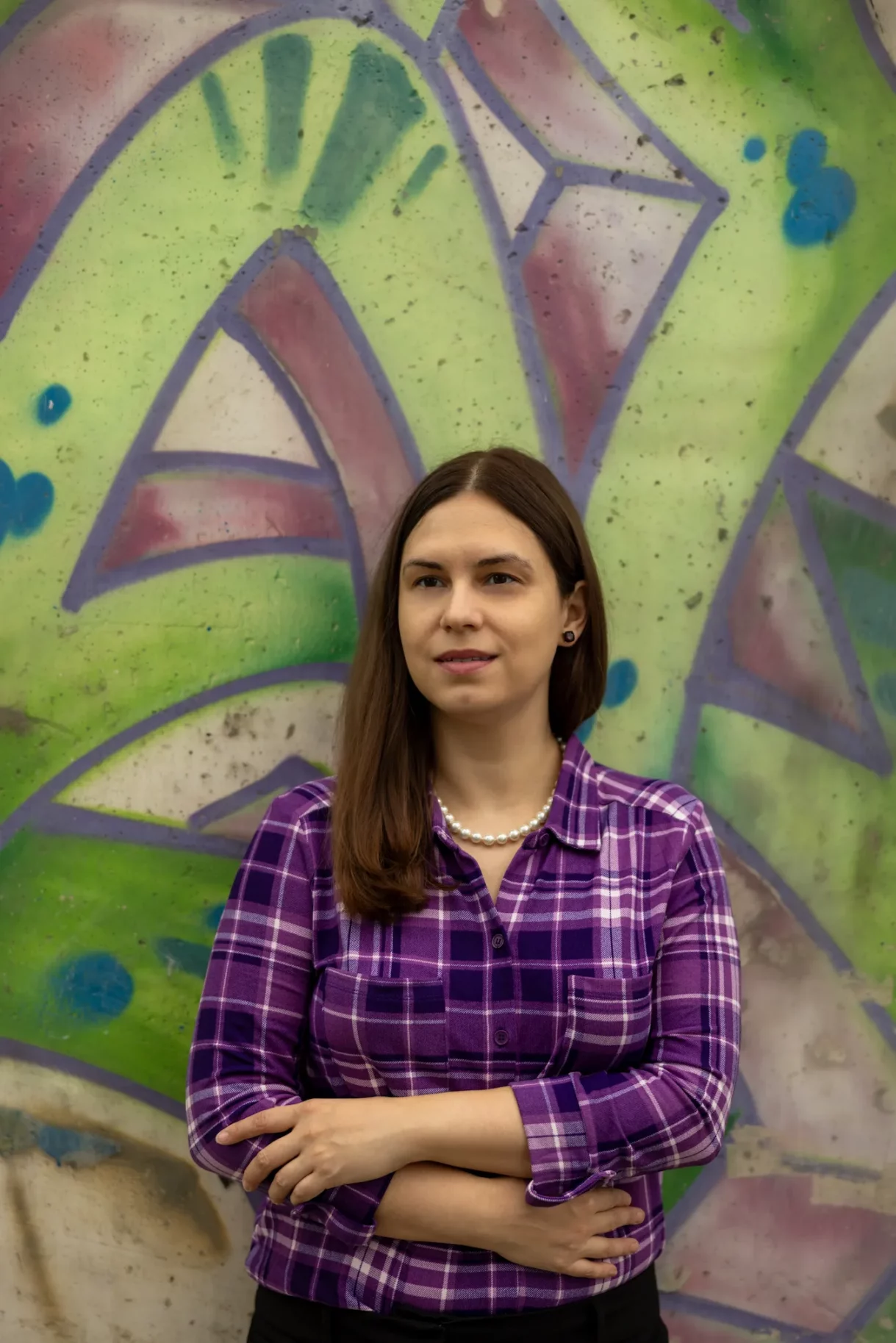 Portrait Against Urban Graffiti in Purple Plaid